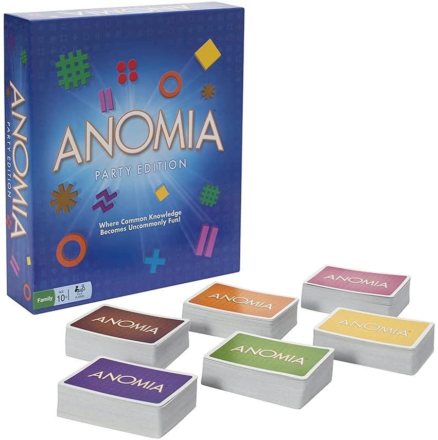 the board game box next to six stacks of cards each with different colored backs