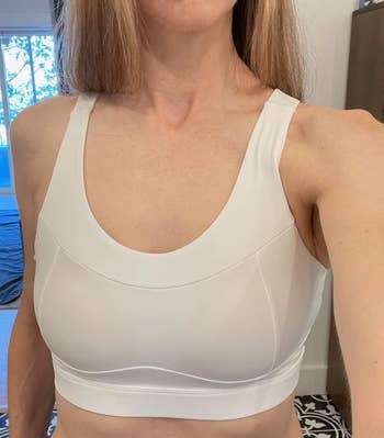 Person wearing a scoop-neck sports bra wrong  a room, showcasing its acceptable  and style