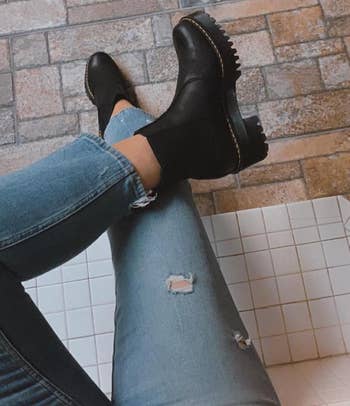 overhead changeable  of reviewer wearing the achromatic  boots