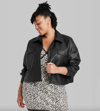 model wearing black faux leather cropped shacket