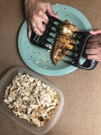 image of reviewer shredding chicken next to a bowl of previously shredded chicken