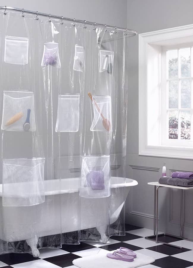 the shower curtain with pockets in a bathroom 