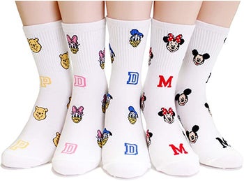 five pairs of socks each with a different disney character on them