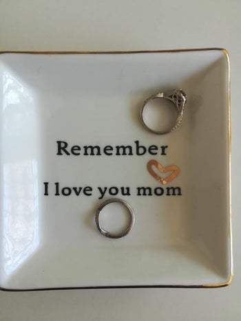 reviewer photo of the trinket dish that reads 