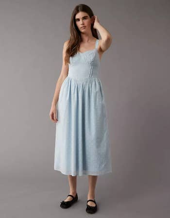 Model in a light blue dress