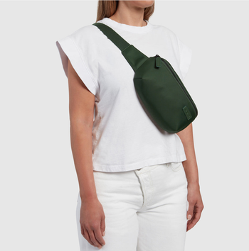 model wearing a green nylon fanny pack across their torso