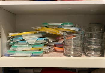 reviewer's cabinet with tupperware lids everywhere