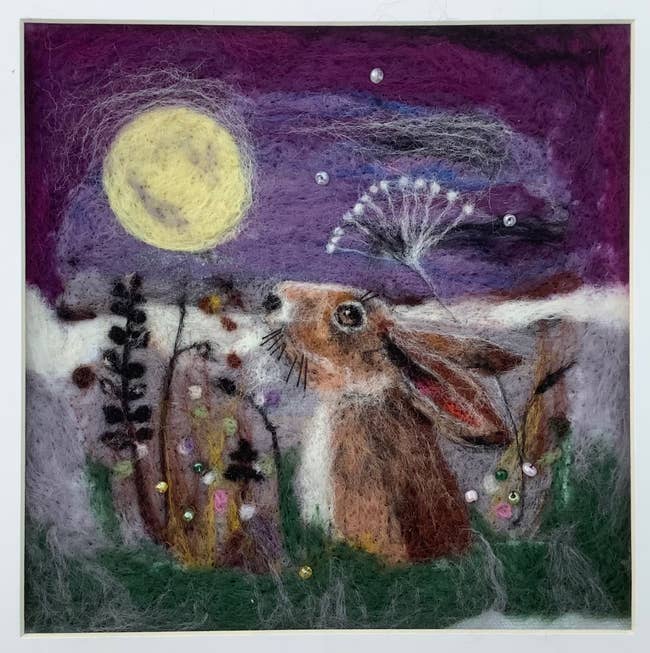 felted piece of art of a bunny gazing at the stars