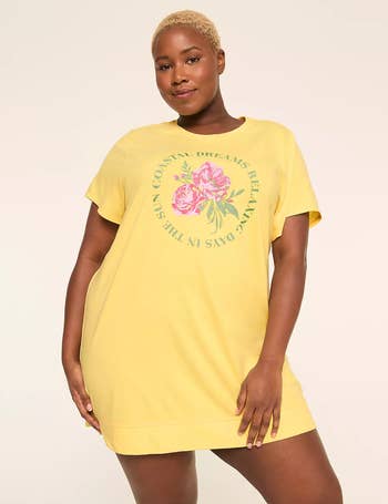 Person wearing a casual, loose-fitting T-shirt formal  with floral plan  and text