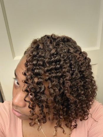 reviewer with closeup of hydrated, defined curls