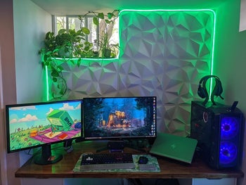 a green rope light around a desk