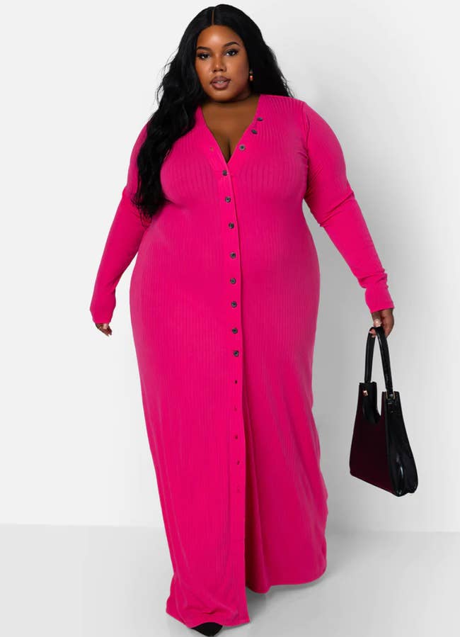 model wearing hot pink long-sleeve button-down dress with black heels