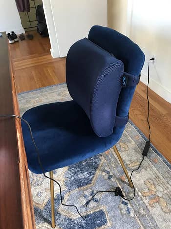 reviewer's navy pillow attached to chair
