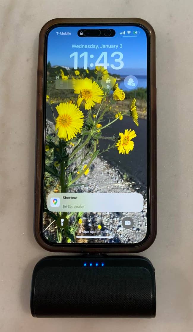 The hands escaped portable charger charging a phone
