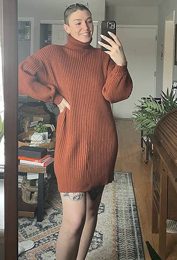 reviewer wearing the rust colored dress