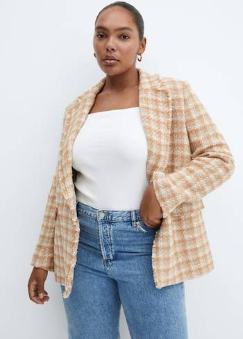 model in the plaid blazer with blue jeans and a white tee