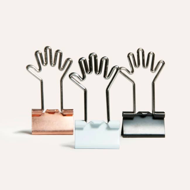 binder clips with hand shaped metal arms 