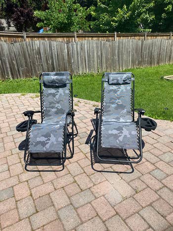 Reviewer's two chairs are shown outside on a brick patio