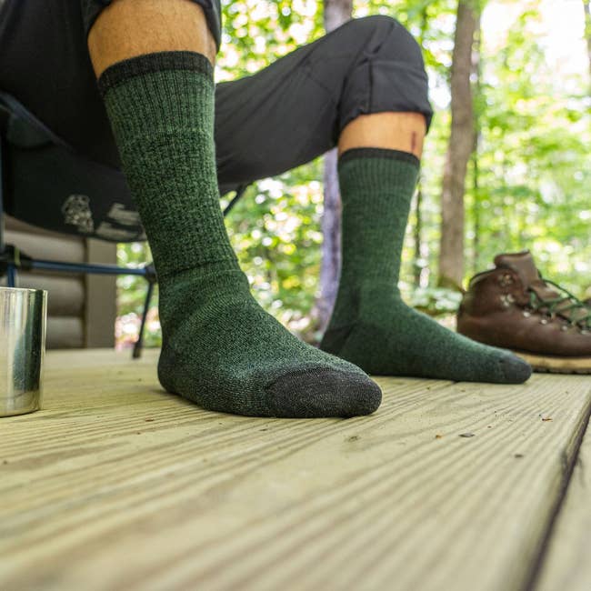 model wearing green mid-calf socks