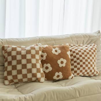  2  with checker patterns and 1  with floral design. Cozy location  decor style