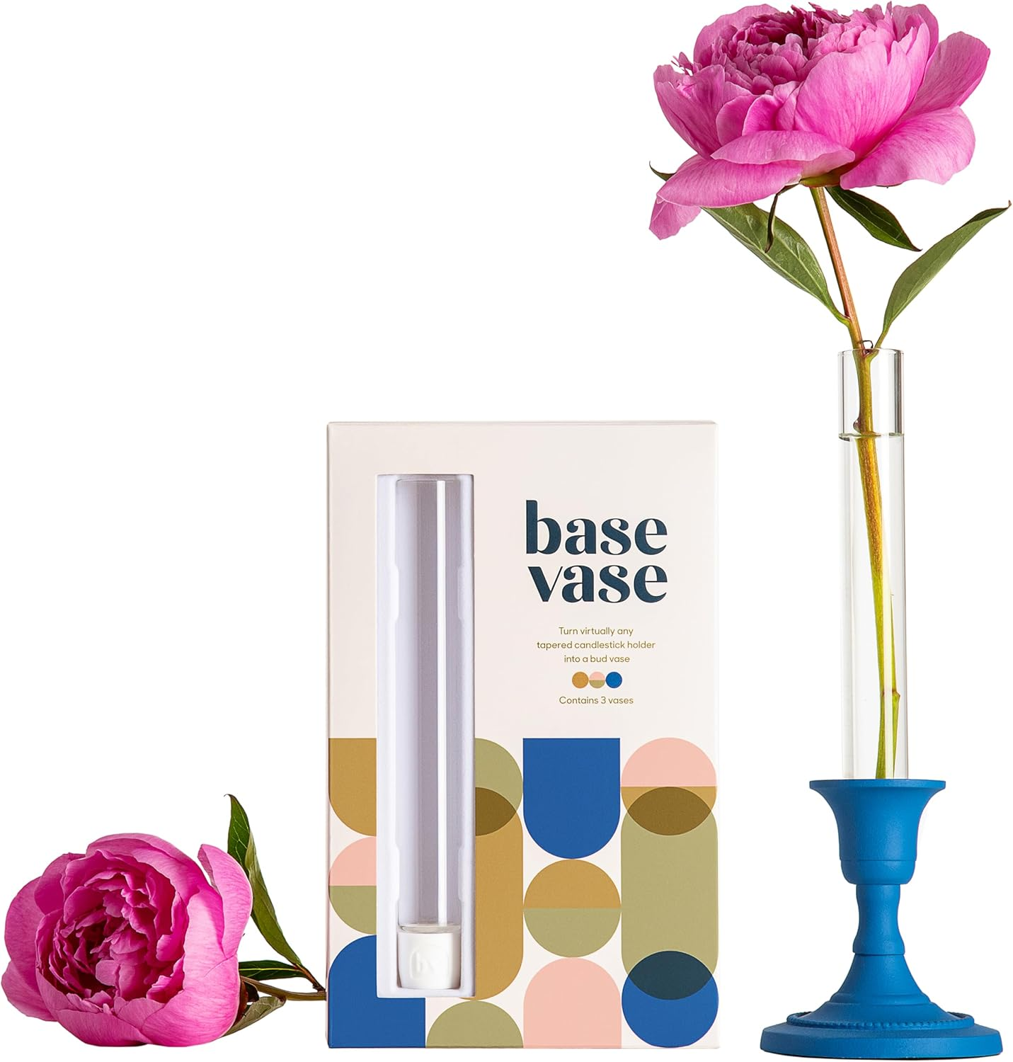 Box of Base Vase next to a tall vase with a single pink flower, promoting innovative vase design