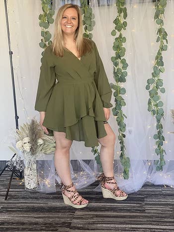 another reviewer wearing the same wrap dress in a green color