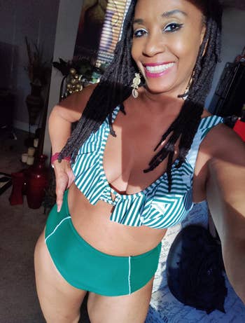 Reviewer in green bottoms and ruffly green and white stripe bikini top 