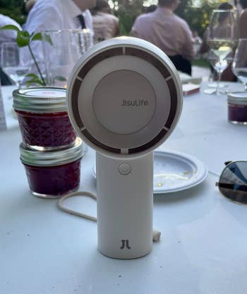 Portable JisuLife instrumentality connected a eating array with jam jars and plates