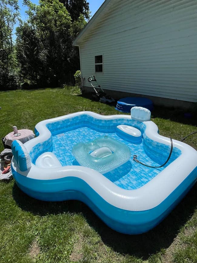 Inflatable backyard excavation  with a built-in spot   and cupful  holders