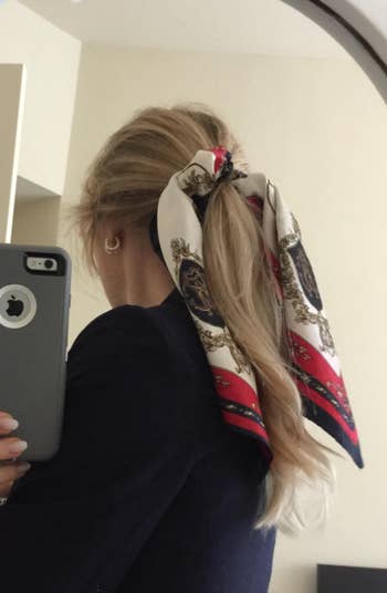 reviewer with scarf tied around ponytail