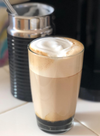 a close up of a reviewer's latte