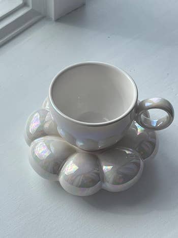 empty white cup on saucer
