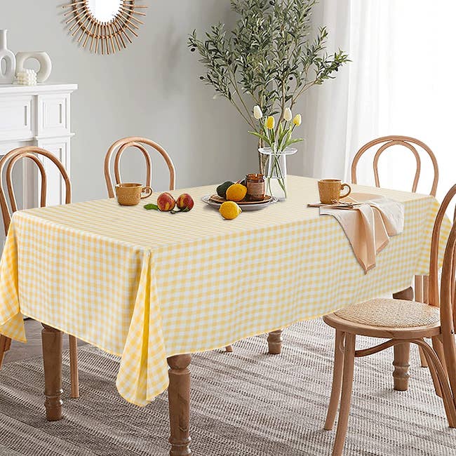 dining room table set with buffalo plaid tablecloth on top