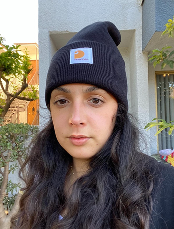 reviewer in black beanie with carhartt label 