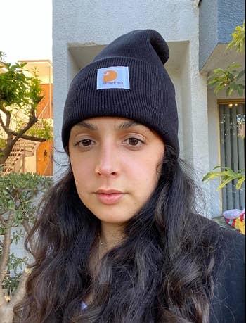 reviewer in black beanie with carhartt label 