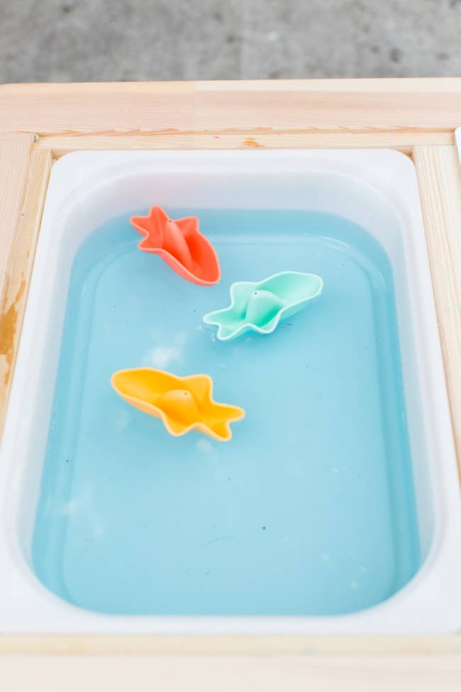 three shark-shaped bath toys