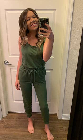 reviewer wearing the green jumpsuit