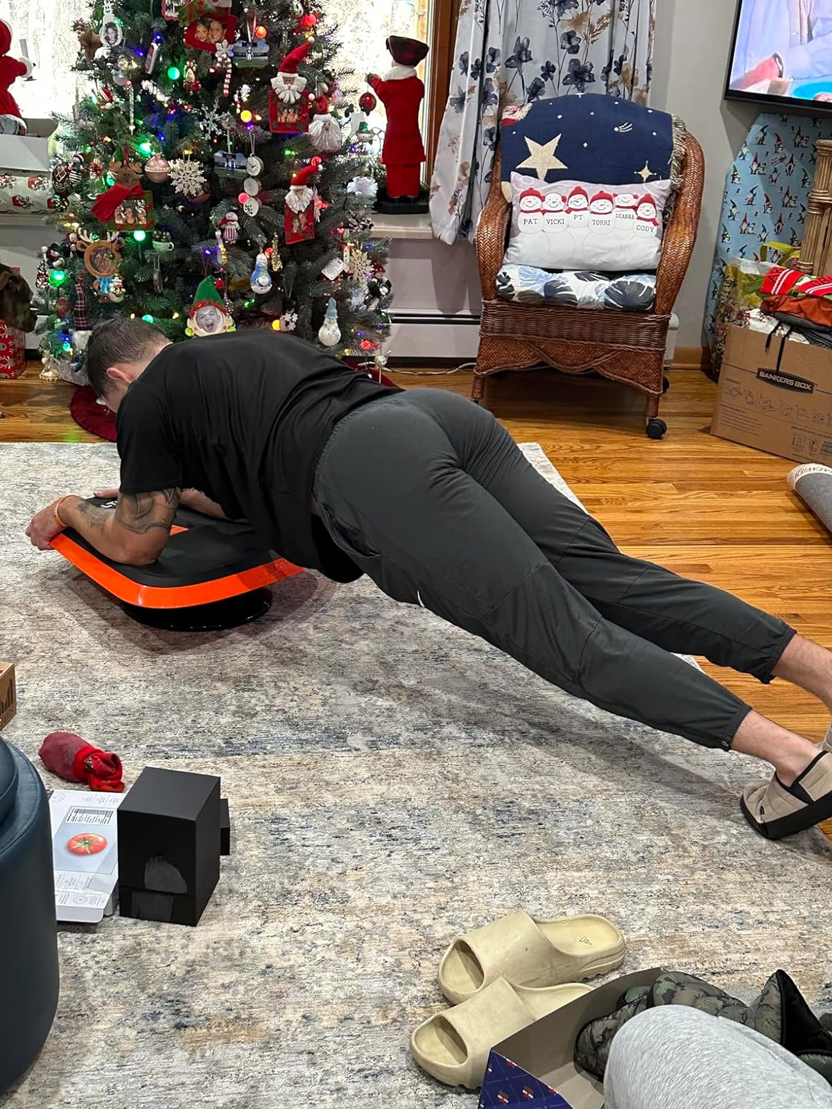 a reviewer doing a plank with the halfway   trainer 