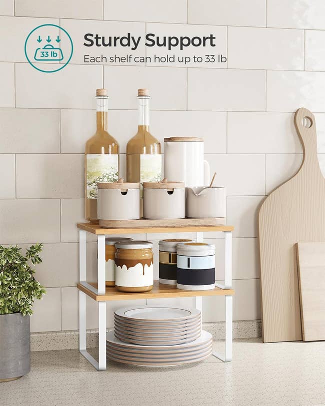 Three-tiered wooden shelf displaying kitchenware and bottles with a text overlay explaining the weight it can hold