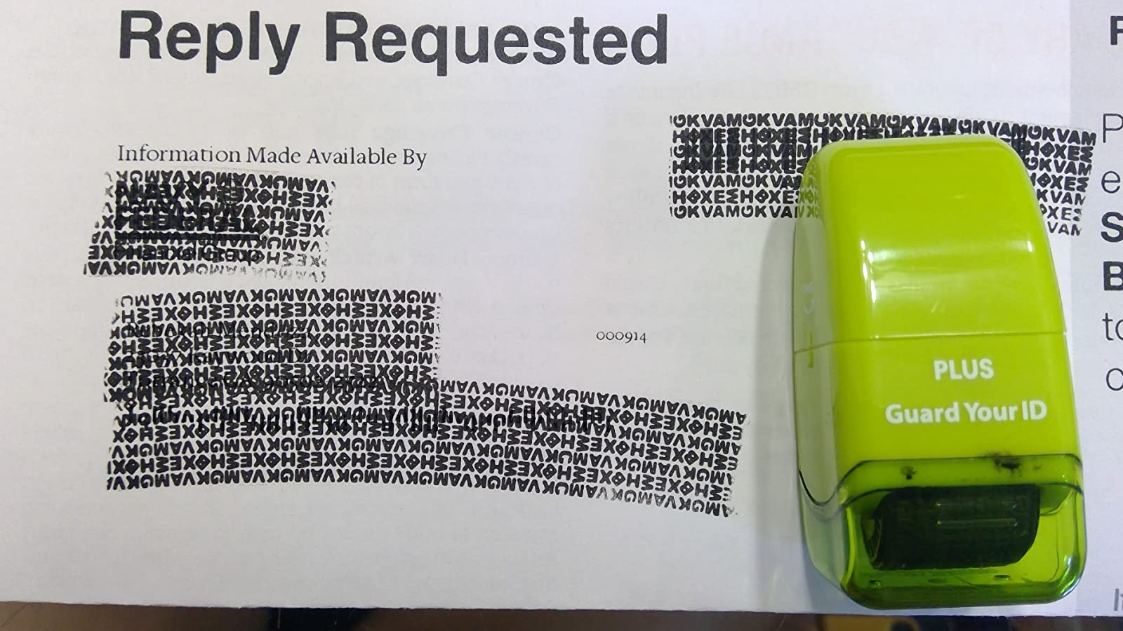 reviewer photograph  of a portion   of message  with their name, address, and different   idiosyncratic   accusation  stamped out, with the greenish  roller resting connected  the mail