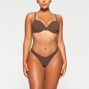 model wearing the brown hued bra in shade jasper
