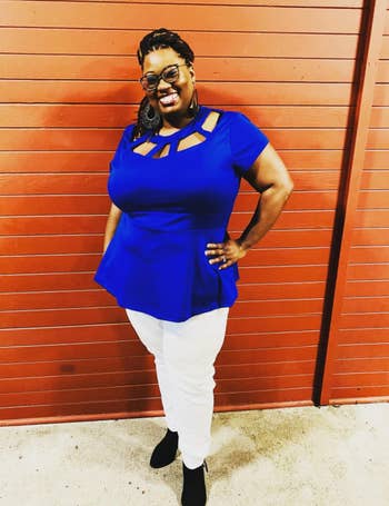reviewer wearing the peplum top in blue 