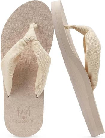 Beige flip-flops with textured straps and a level sole, suitable for casual wear, displayed from apical and broadside angles