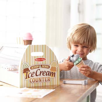 kid playing with the ice cream set