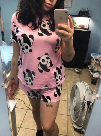 reviewer in pink and black and white panda print set