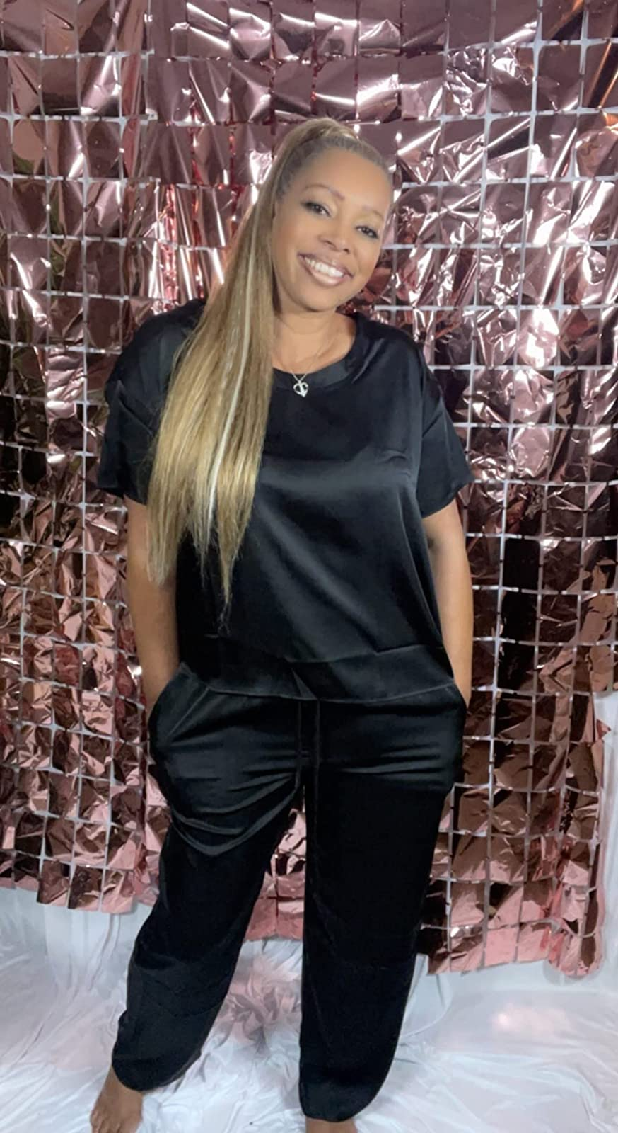 A reviewer wearing the set in black 