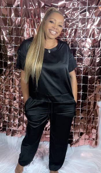 A reviewer wearing the set in black