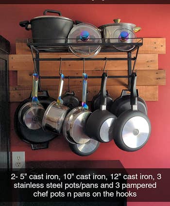 Reviewer image of product with pots on shelf and hanging on hooks