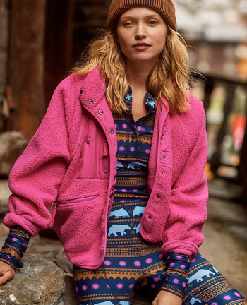 Model in an magenta zippered fleece jacket 