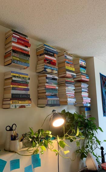 another reviewer covers the wall in books with the floating shelves